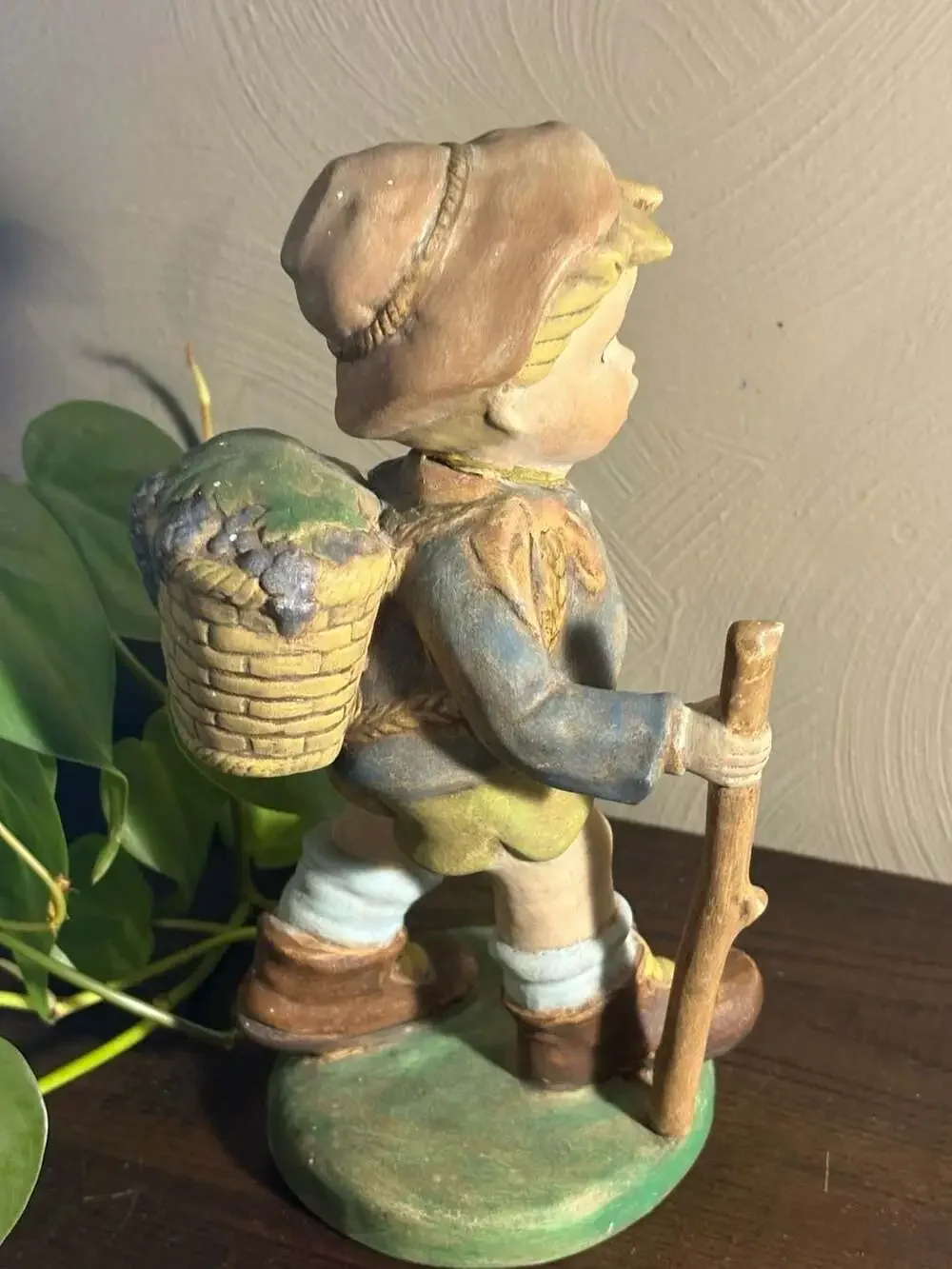 Vintage 9-inch Chalkware Boy with Walking Stick and Grape Basket Figurine